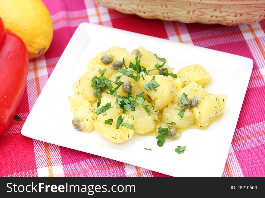 Fresh salad of potatoes on a plate