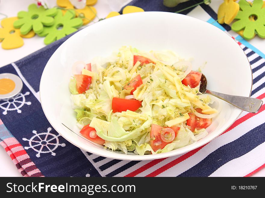 Fresh salad with tomatoes and cheese in a bowl