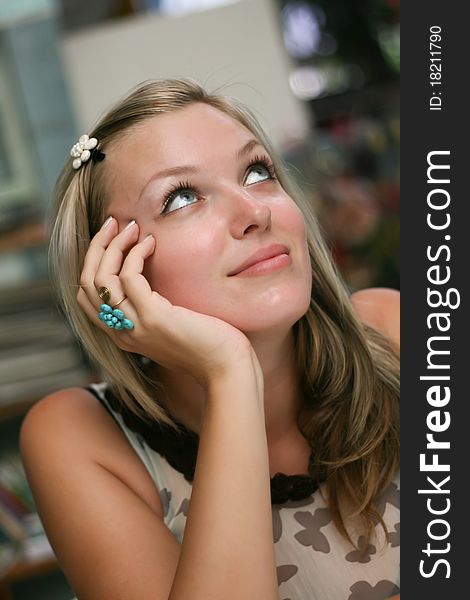 Portrait of a beautiful blonde woman with long hair and a smile