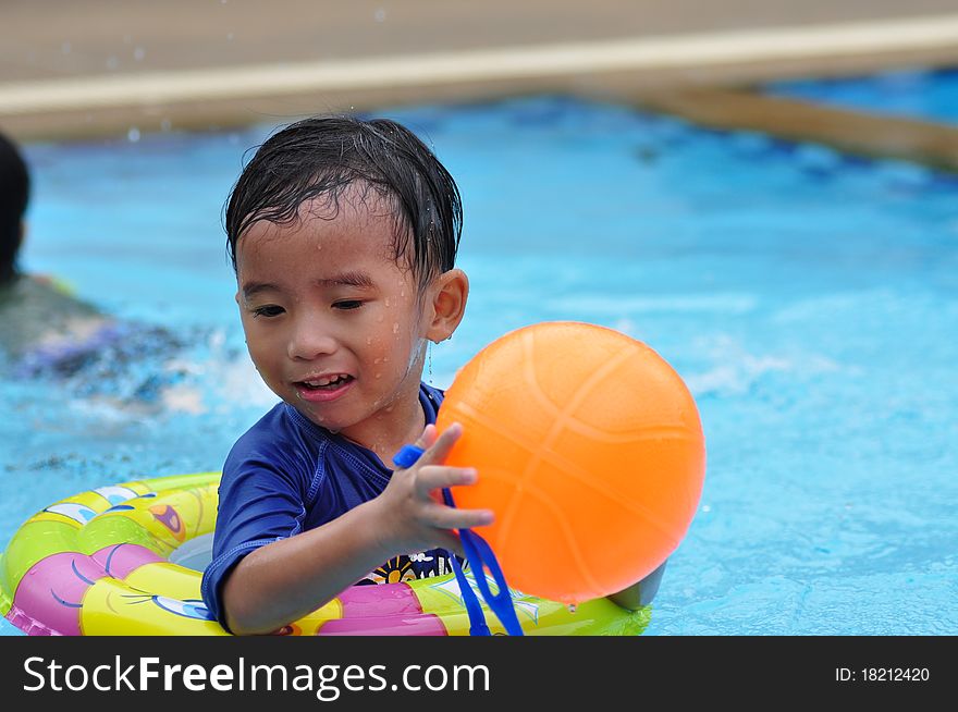 Happy time asian boy in the pool