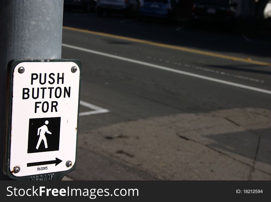 Push this button to walk across the stree. Push this button to walk across the stree