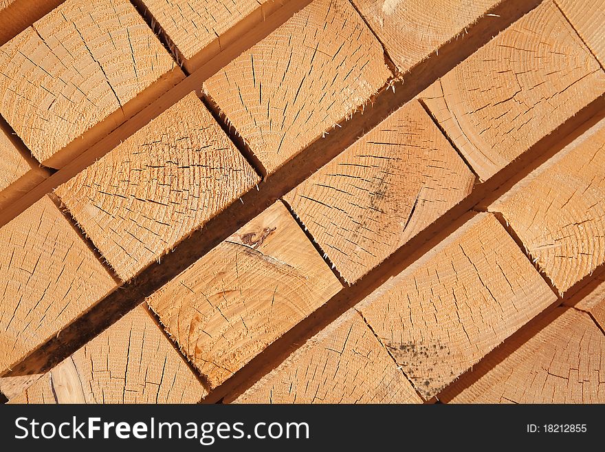 Stack of new wooden studs at the lumber yard. Stack of new wooden studs at the lumber yard