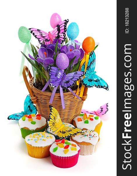 Easter arrangement with crocuses, cupcakes, butterflies and eggs