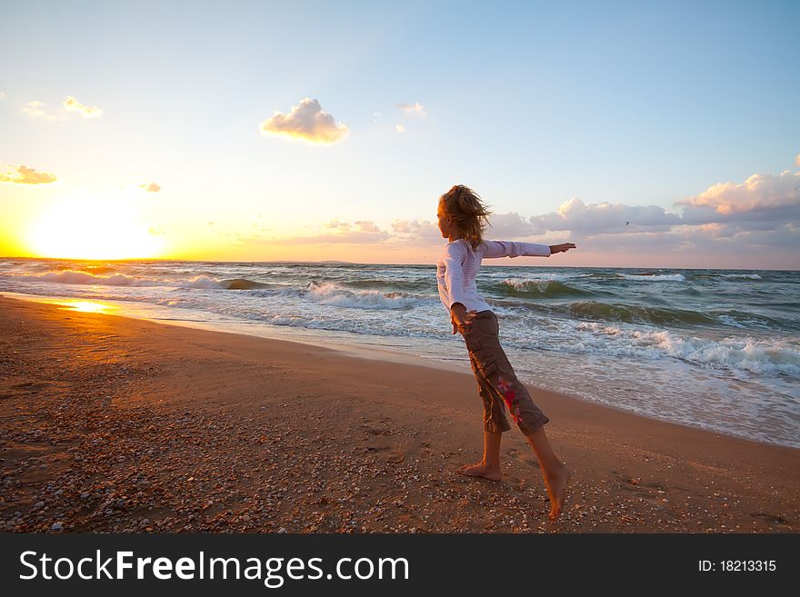 Beautiful girl exercising on the coastline. Beautiful girl exercising on the coastline