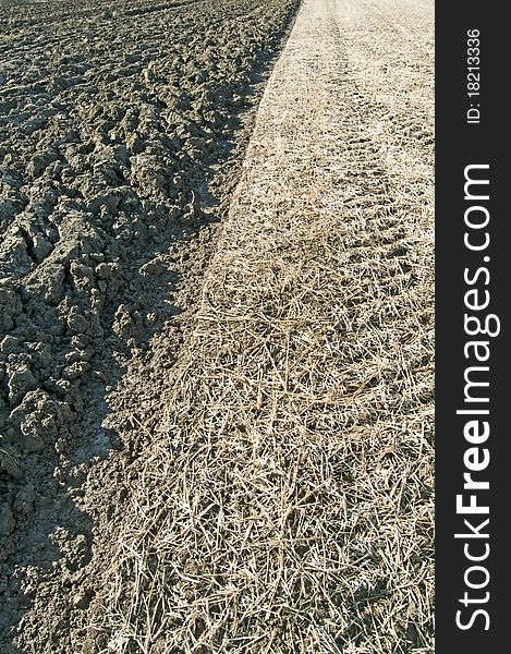 Acre and stubble field side by side