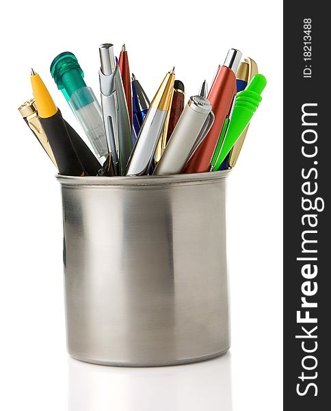 Holder basket full of pencils and pens isolated on white background