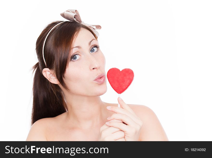 Female portrait with heart candy. Female portrait with heart candy