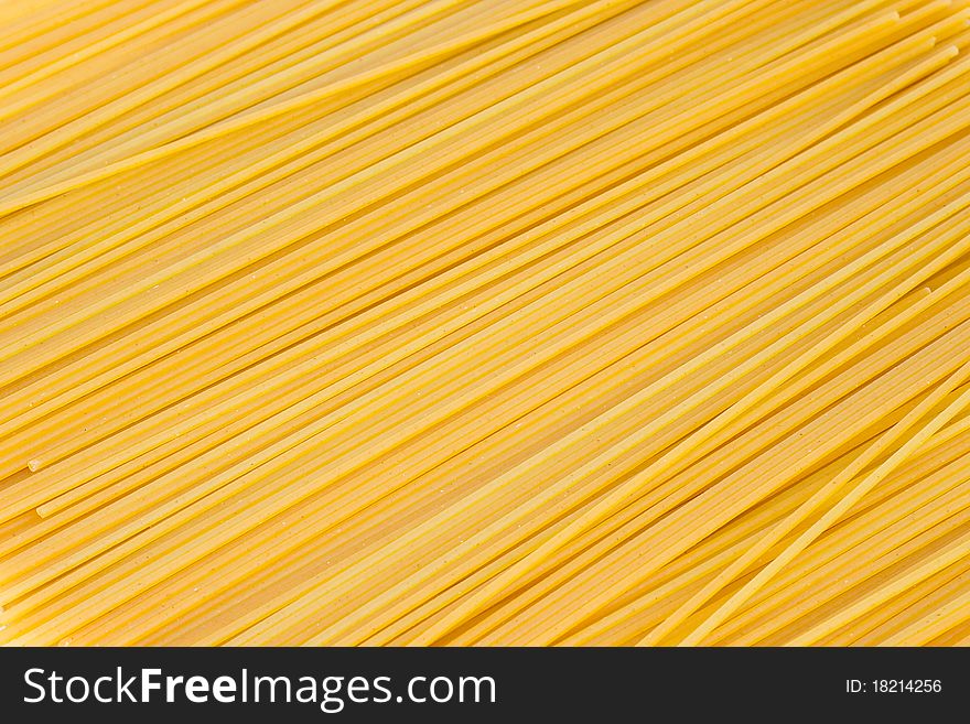 Dry Italian spaghetti pasta as a background