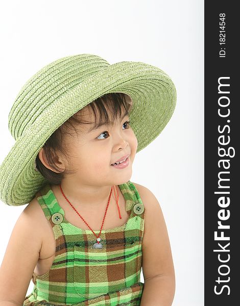 A smiling girl close-up wearing small straw hat。