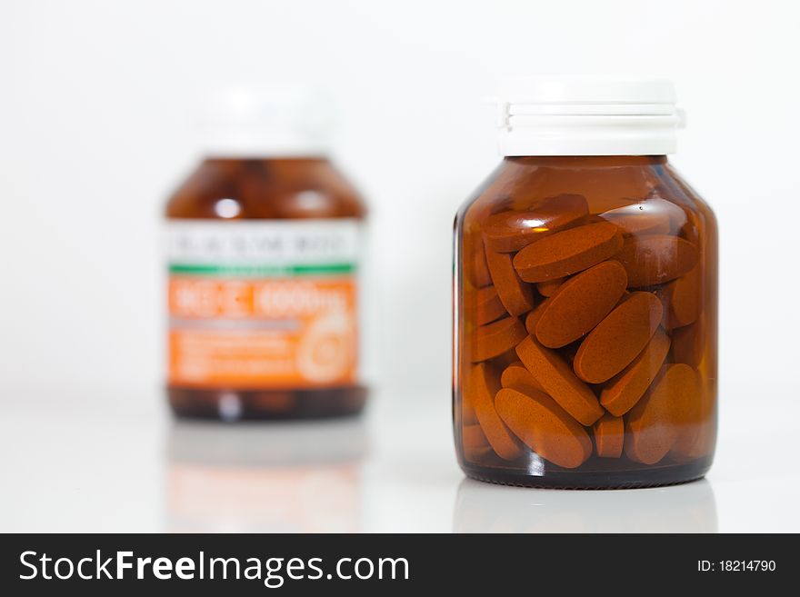 Details of medicine bottles isolated on white