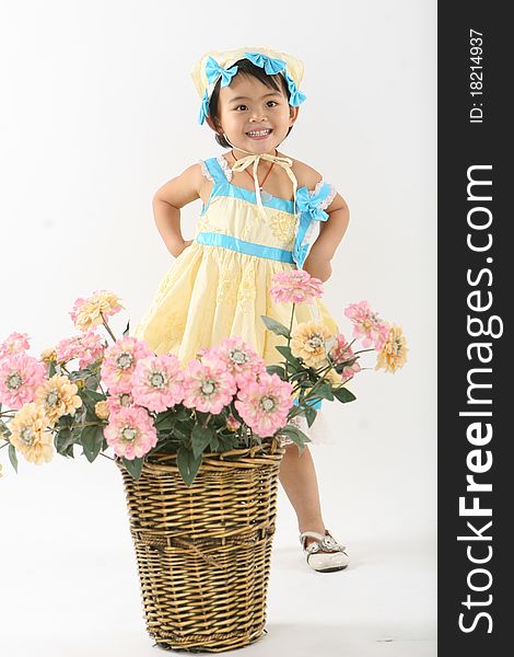 A lovely Chinese girl and a basket of flowersã€‚