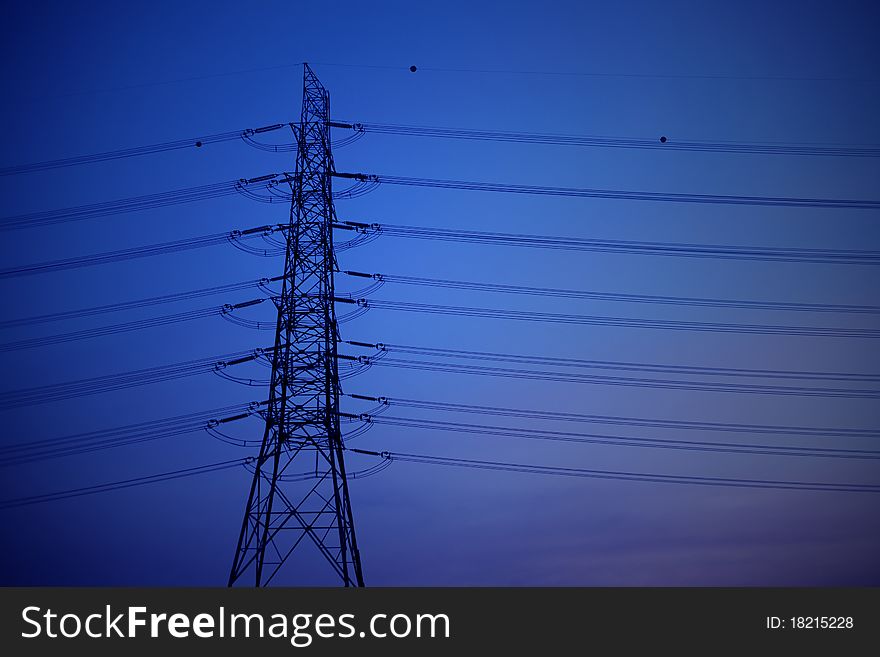 High voltage post with blue sky