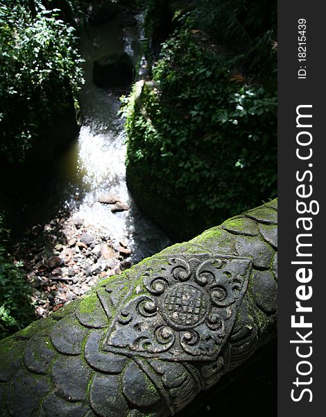 Image of an old stone bridge and the Asian river