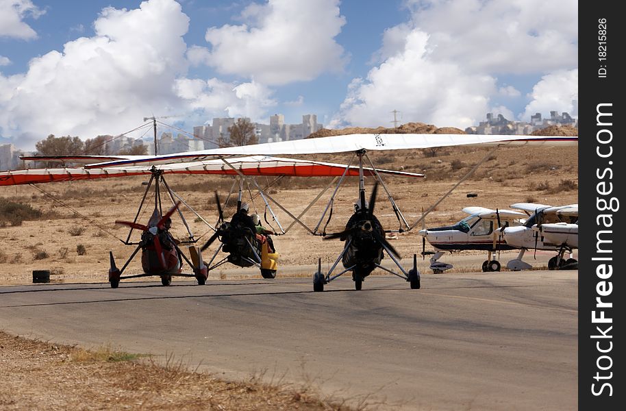 Small ultra light airplane in desert airport