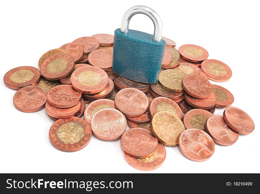 Padlock on coin pile as a symbol of financial protection. Padlock on coin pile as a symbol of financial protection.