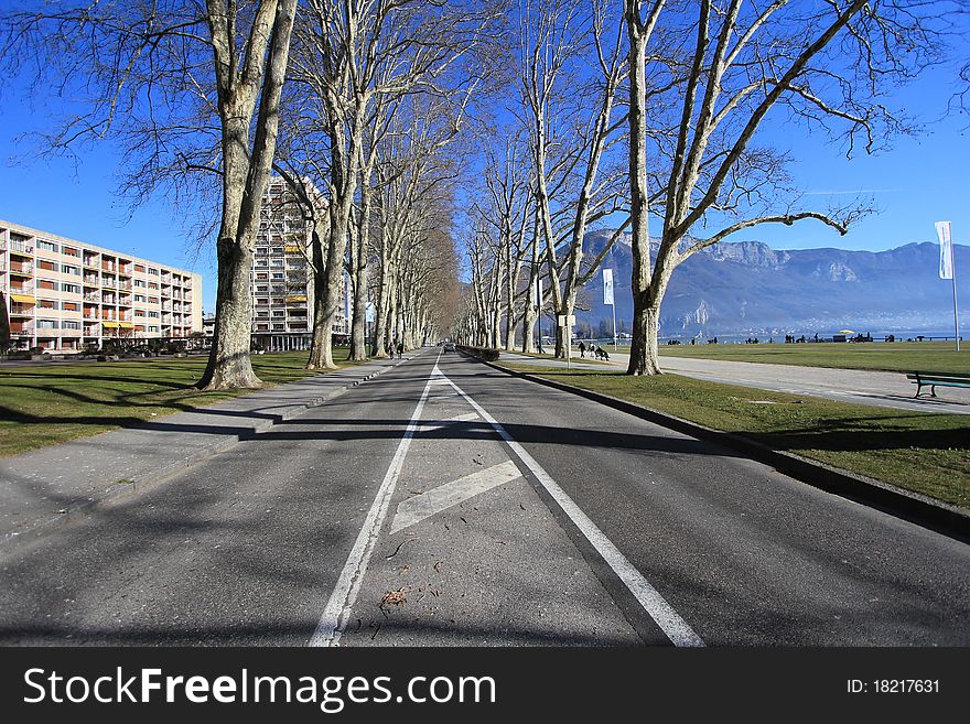 Annecy and trees and road. Annecy and trees and road