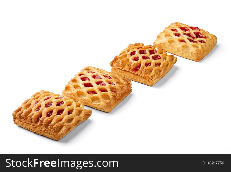 There are four puffs with jam on a white background.