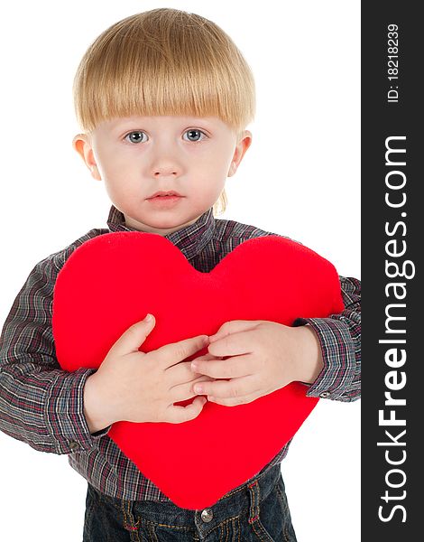 Little beautiful boy holds heart isolated on white