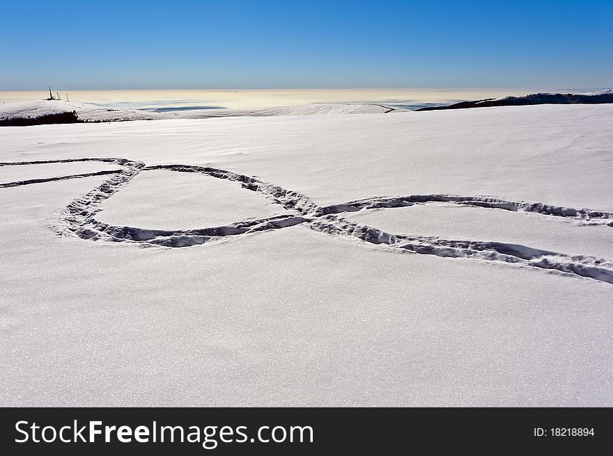 Footprints in the snow on a mountain ridge