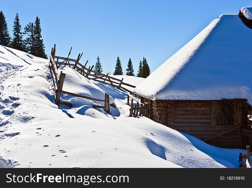 Refuge for shepherds in winter mountain scenery