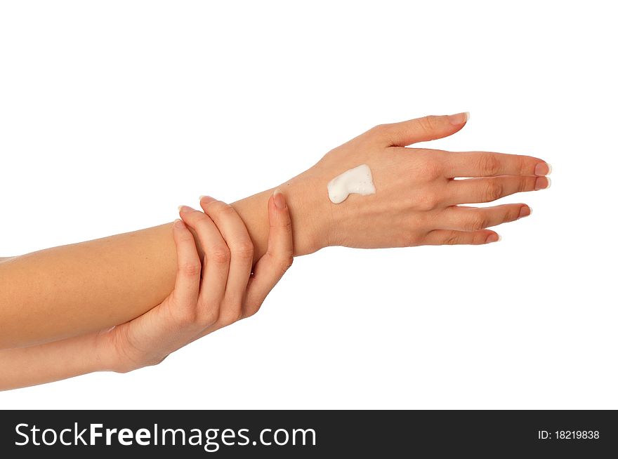 Woman lubricates the hands skin with vitaminized cosmetic cream. Woman lubricates the hands skin with vitaminized cosmetic cream