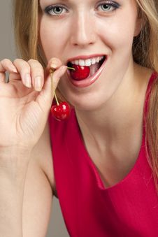Woman With Red Cherries Stock Photos
