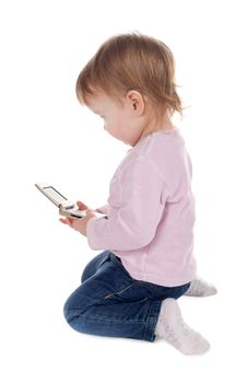 Girl Plays With Mobile Phone Royalty Free Stock Photography