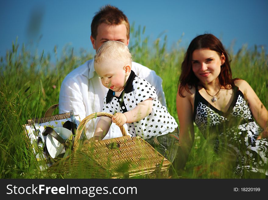 Picnic of happy family on green grass. Picnic of happy family on green grass