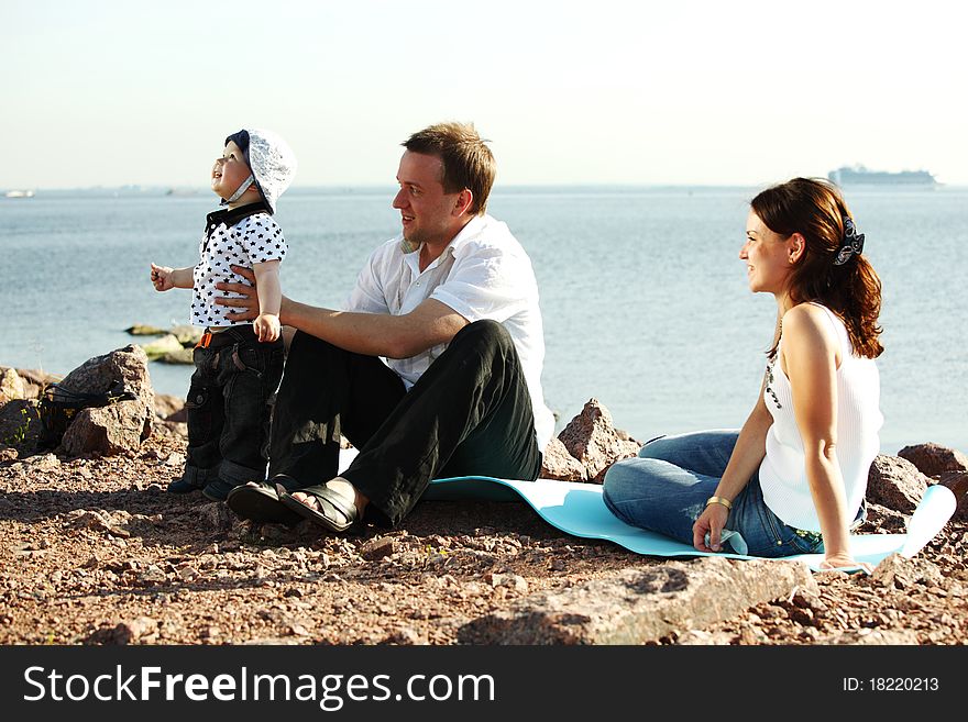 Picnic of happy family near sea. Picnic of happy family near sea