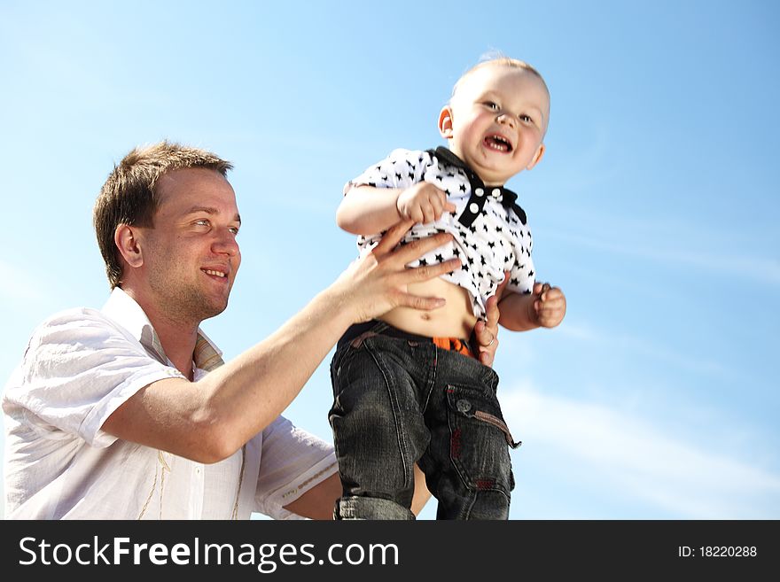 Father and take son in blue sky. Father and take son in blue sky