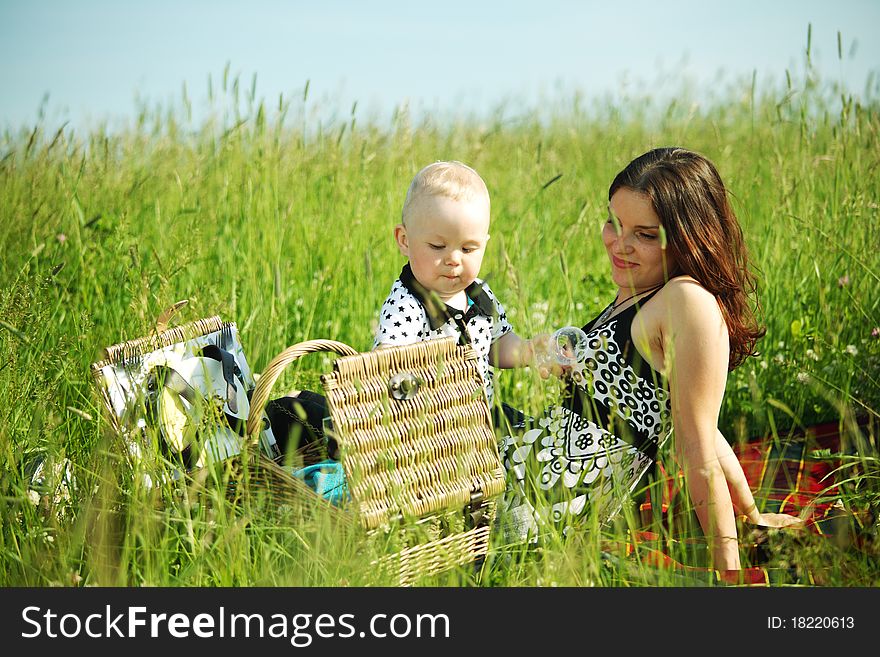 Picnic of happy family on green grass. Picnic of happy family on green grass