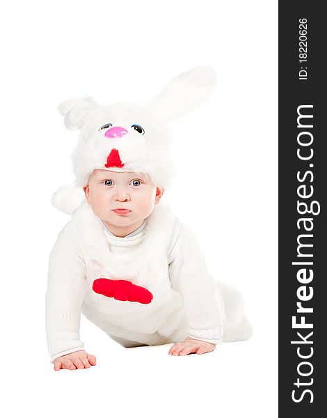 Little beautiful boy in rabbit costume with carrot isolated