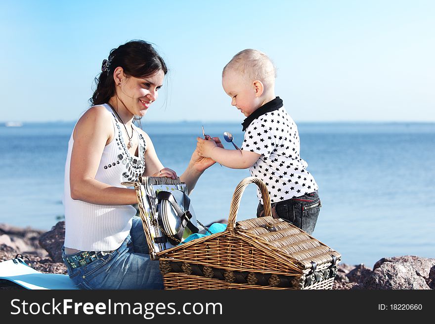 Picnic of happy family near sea. Picnic of happy family near sea