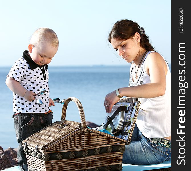 Picnic of happy family near sea. Picnic of happy family near sea