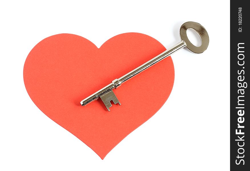 Large silver key pointing to the center of a large red heart isolated on white background. Large silver key pointing to the center of a large red heart isolated on white background