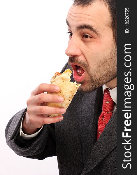 Image of busy man eating breakfast