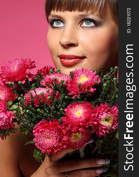 Portrait of a young woman with pink flowers. Portrait of a young woman with pink flowers
