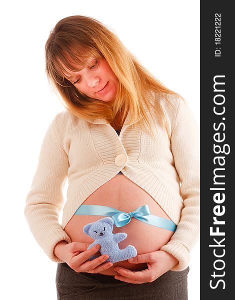 Beautiful pregnant woman with blue ribbon on her belly