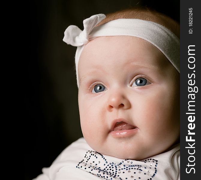 Little beautiful baby with white bandage portrait. Little beautiful baby with white bandage portrait