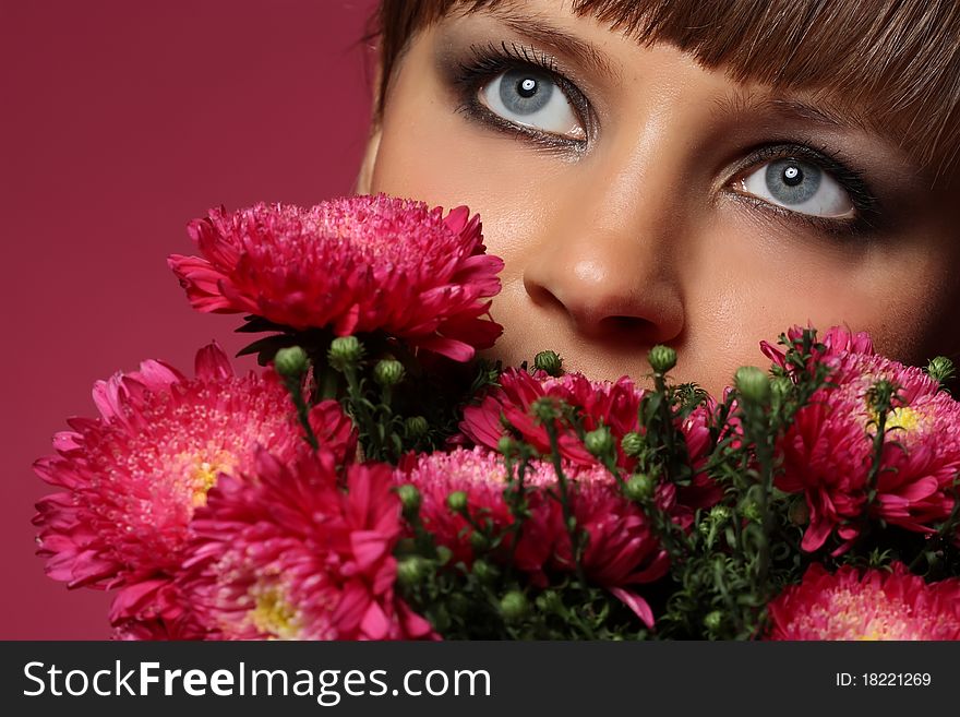 Portrait of a young woman with pink flowers. Portrait of a young woman with pink flowers