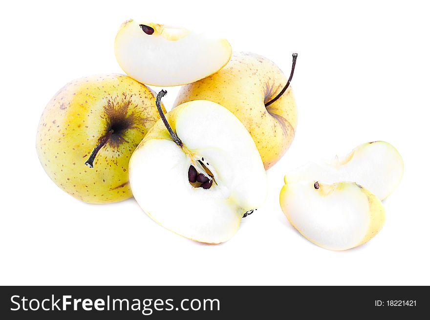 Yellow apples and its slices isolated over white