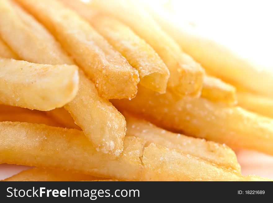 Fries french potatoes closeup isolated on white