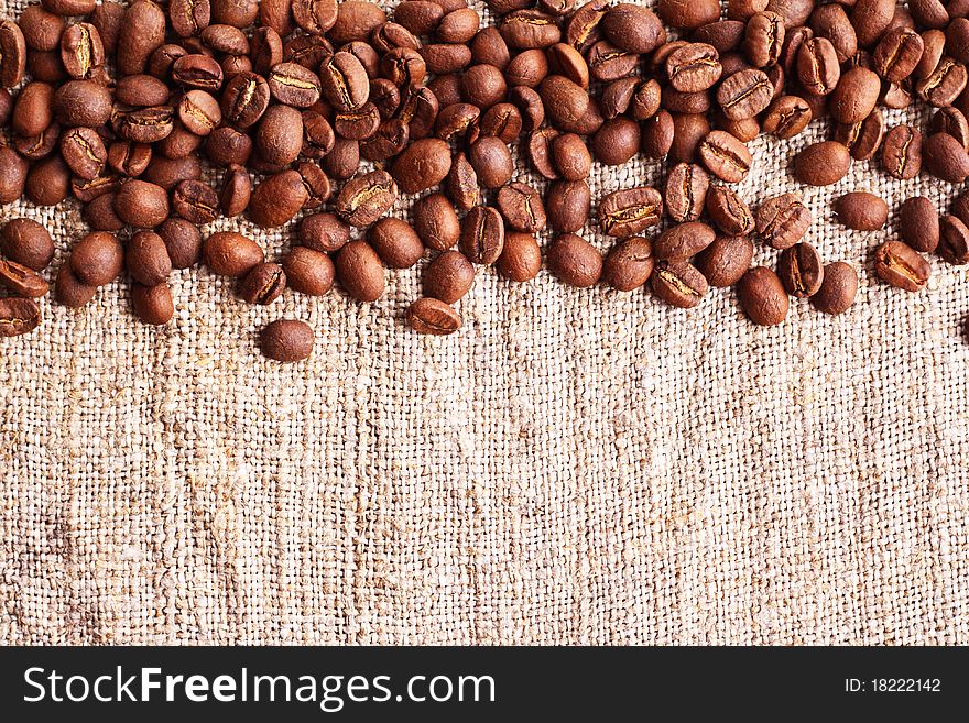 Grains of coffee on a fabric. Horizontal