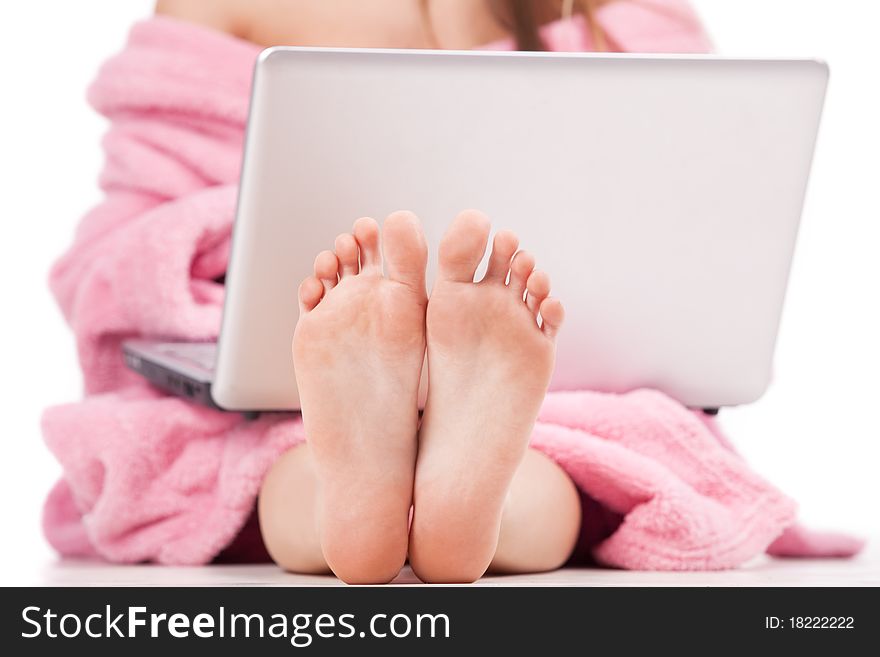 Female feet in front view of laptop. Female feet in front view of laptop