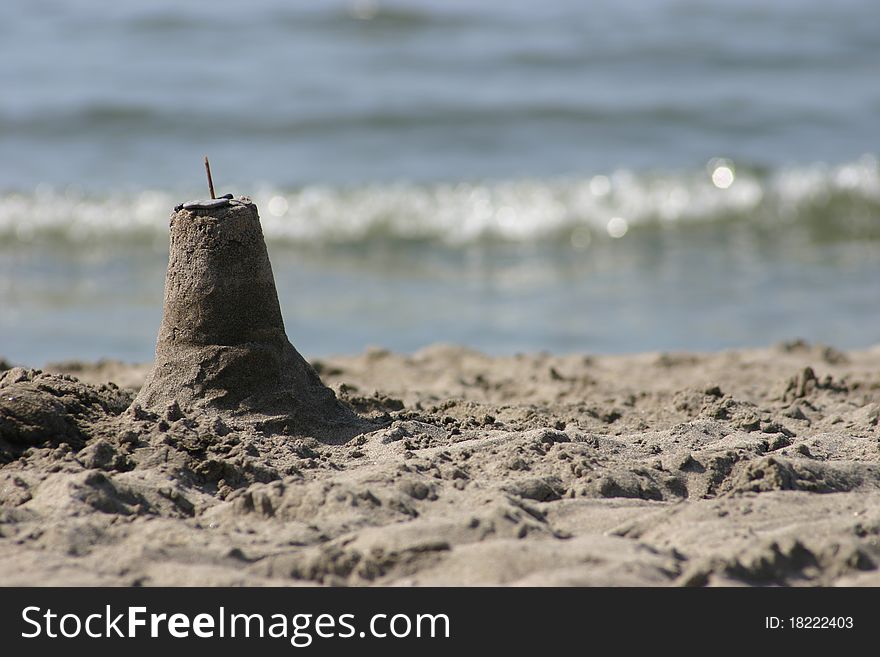 Small sandcastle on beach - Cobourg, Ontario, Canada