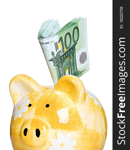 Yellow ceramic piggy bank, full of European banknotes. Yellow ceramic piggy bank, full of European banknotes