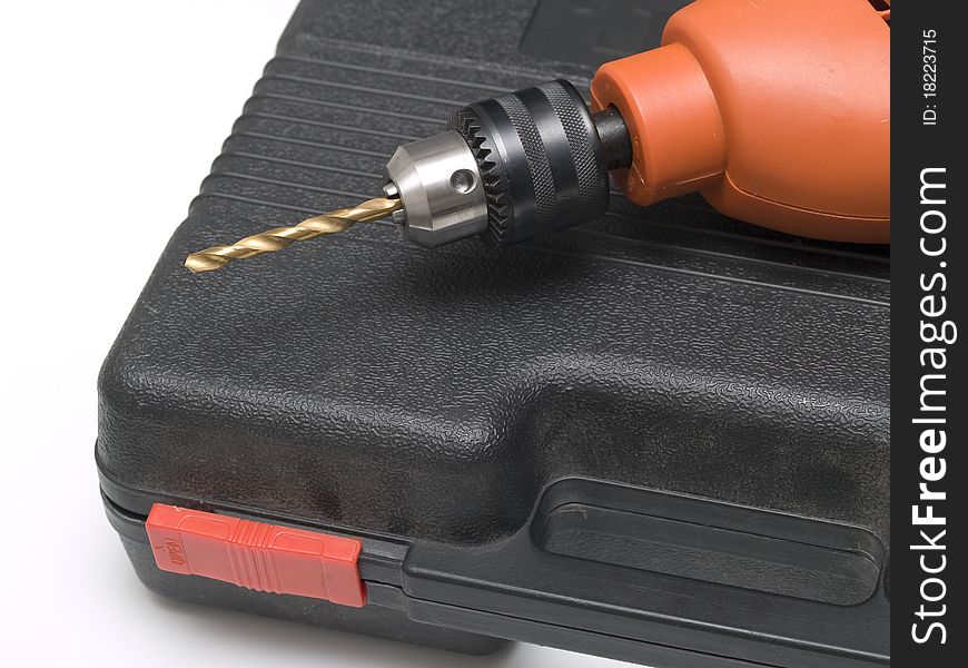 An electric drill on the case in close-up