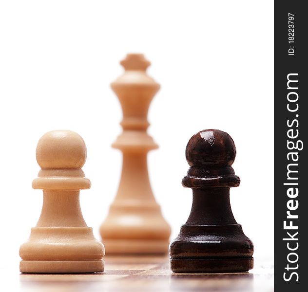 Black and white chess pieces isolated on a white background