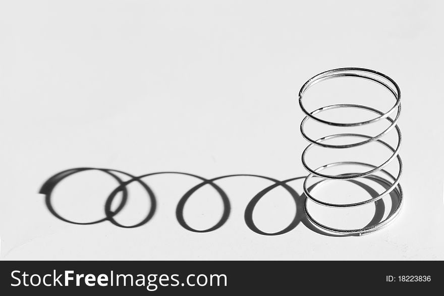 Photo of a Helical spring with shadow...