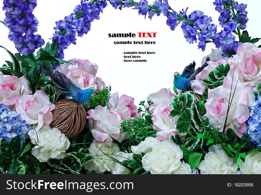 Little birds in artificial flowers.